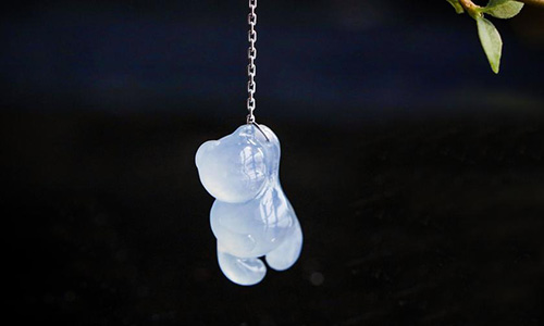 Jade pendant design featuring light blue jade bear pendant on silver chain