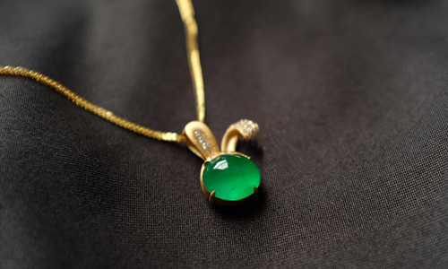 Jade pendant necklace office style with rabbit motif in gold
