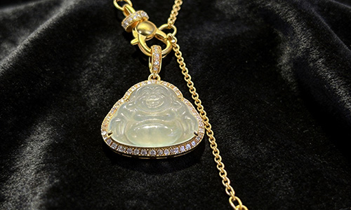Jade vs serpentine difference shown with jadeite ring and serpentine specimen side by side